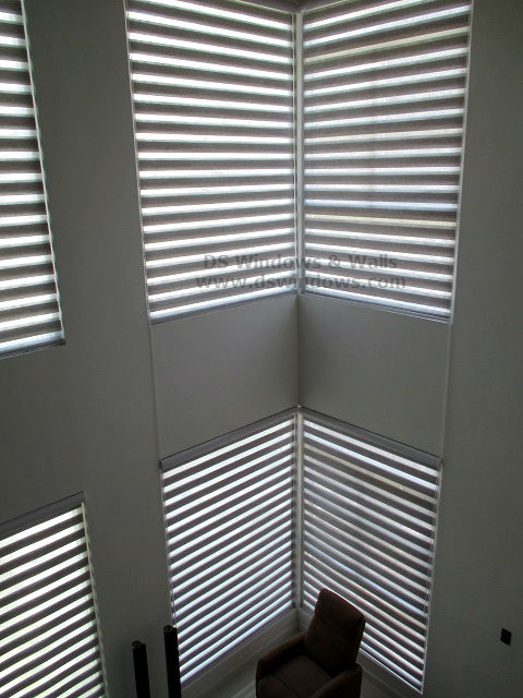 Dual Shade Blinds Installed In A High Ceiling Living Room